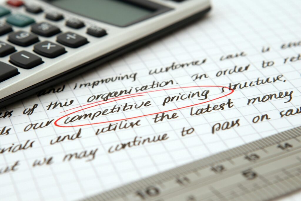pexels photo 262470 262470 Focused image of handwritten business notes with calculator emphasizing pricing strategy.
